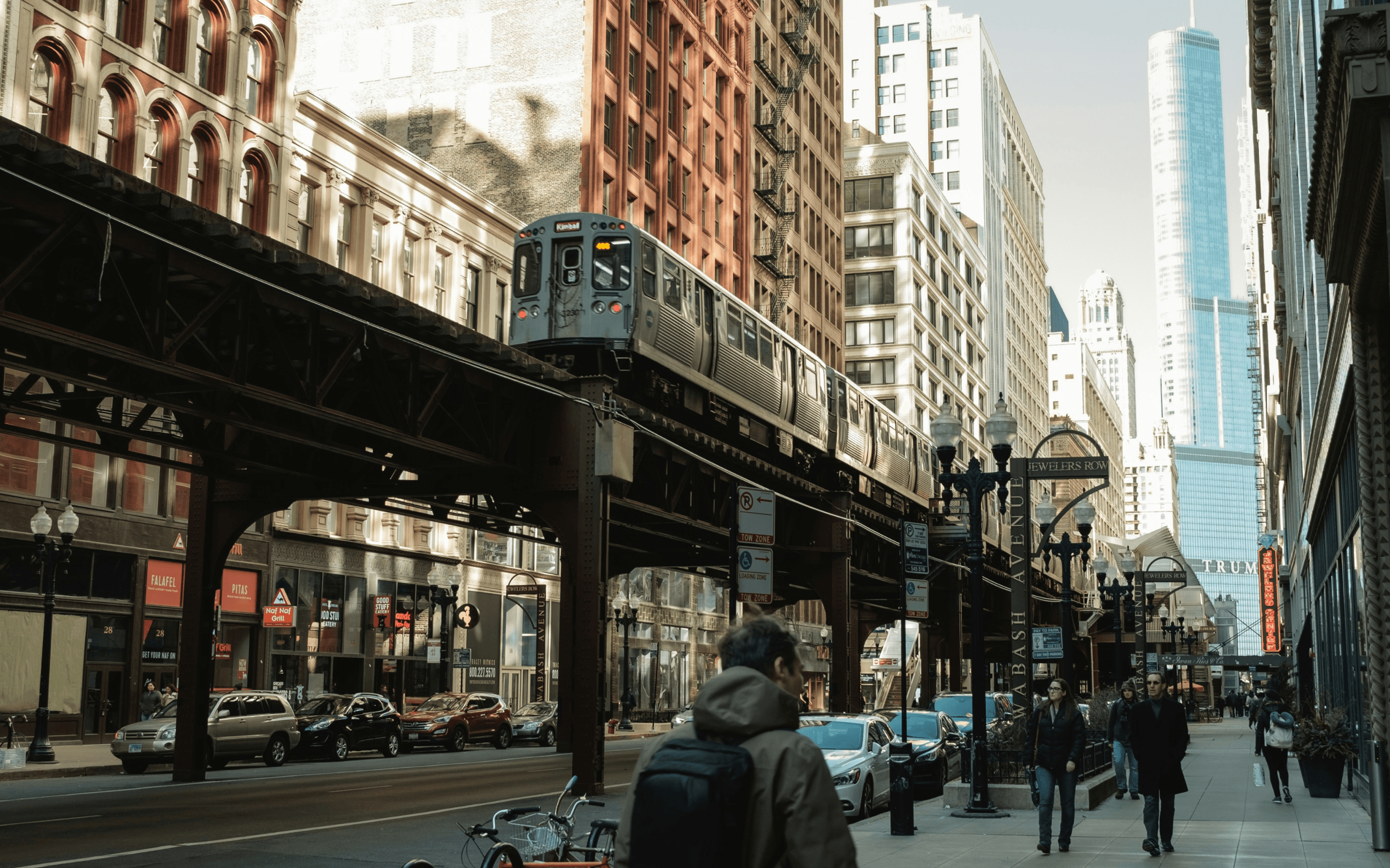 Crowded CTA train platform during evening rush hour in Chicago with commuters waiting
